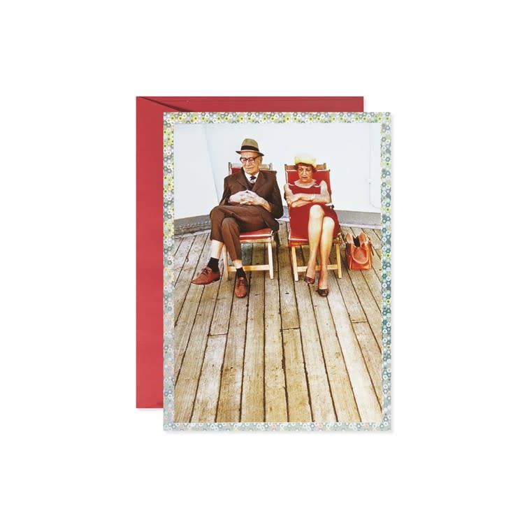 Anniversary greeting card featuring an illustration of an older couple on a yacht deck.