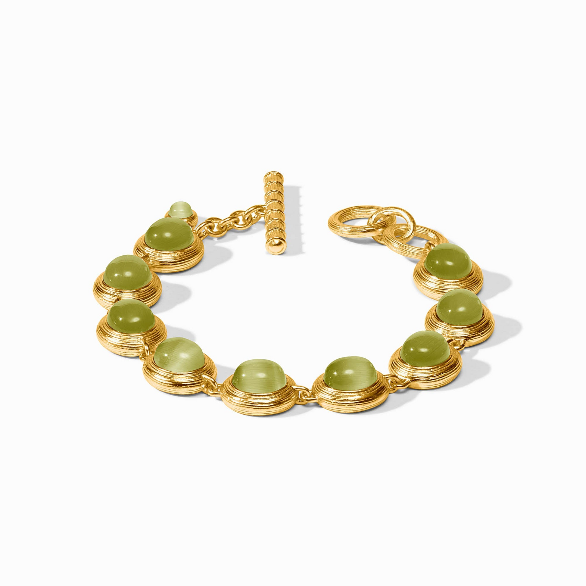 Gold-plated Cobblestone Tennis Bracelet with green glass cabochons and a toggle closure.