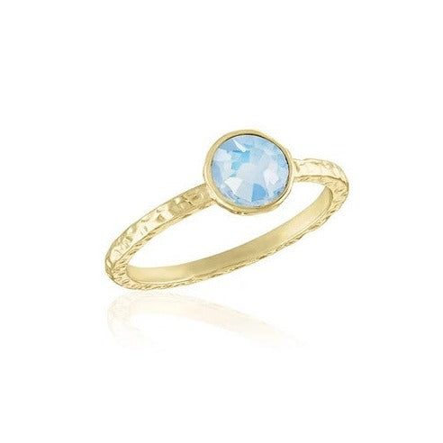 Silver layered ring with a delicate band featuring an oval-cut central stone.