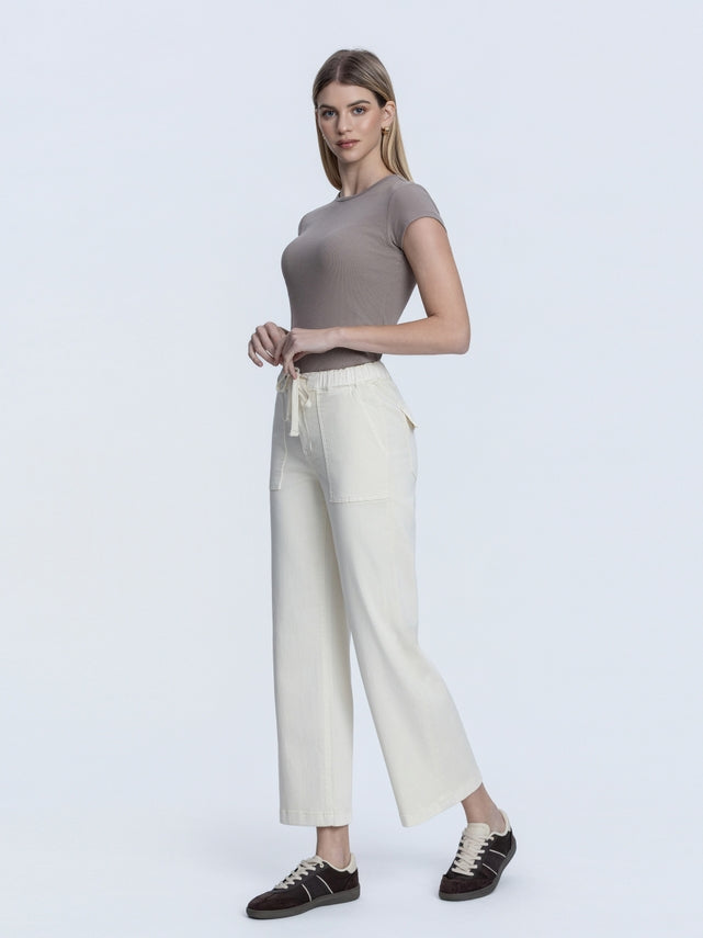 Front view of Bianca high-rise baggy wide jeans in faded blue denim with a front drawstring waistband.