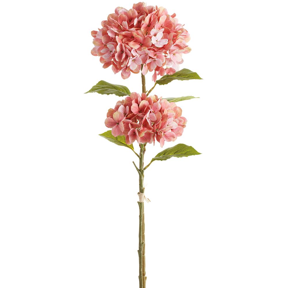 Artificial hydrangea bundle with blue flowers on green stems in a clear vase.