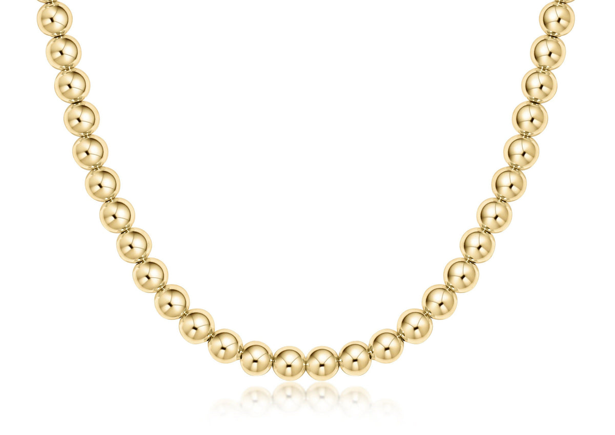 Classic gold choker necklace featuring a continuous strand of round 6mm beads.