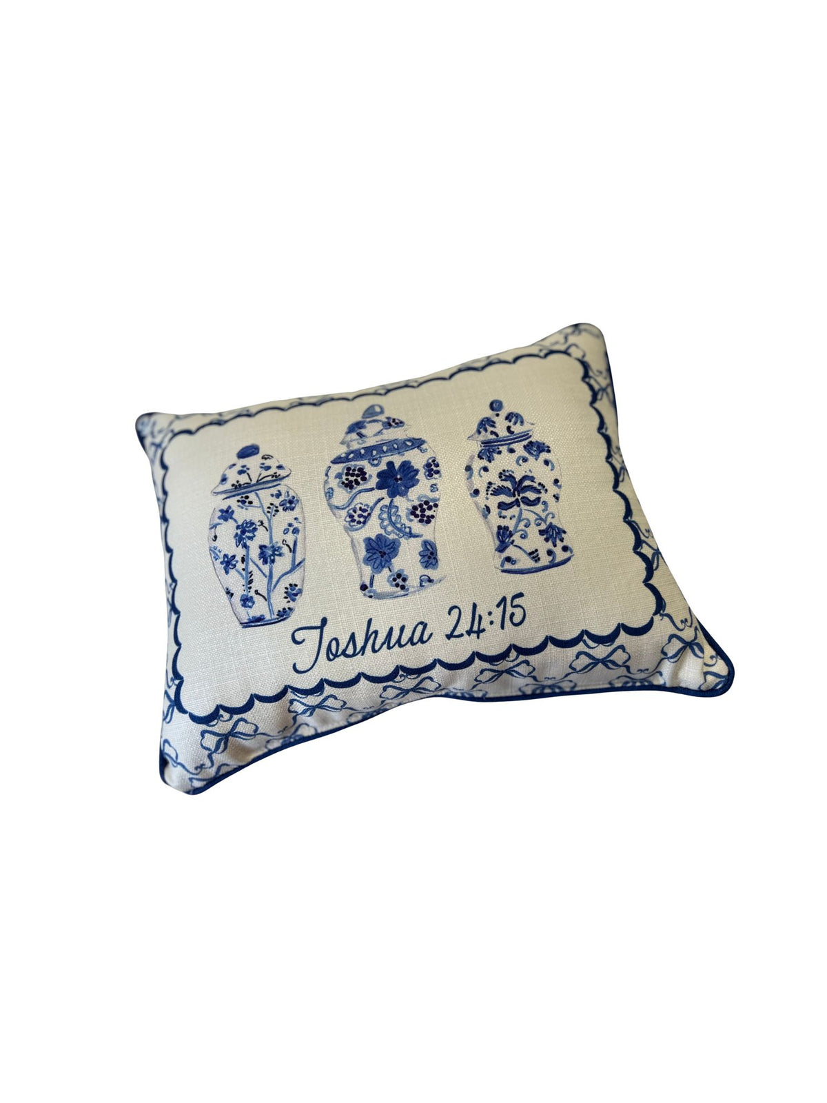 Chinoiserie vase and bow pillow with blue accent piping and Joshua 24:15 script.