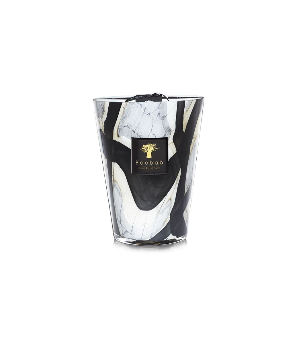 Baobab Collection Marble Stones candle in a hand-blown glass vessel with black and white patterns.