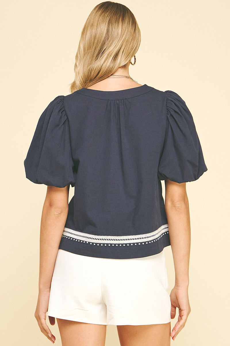 Gail embroidered detail balloon short sleeve V-neck blouse in white cotton with shirring.