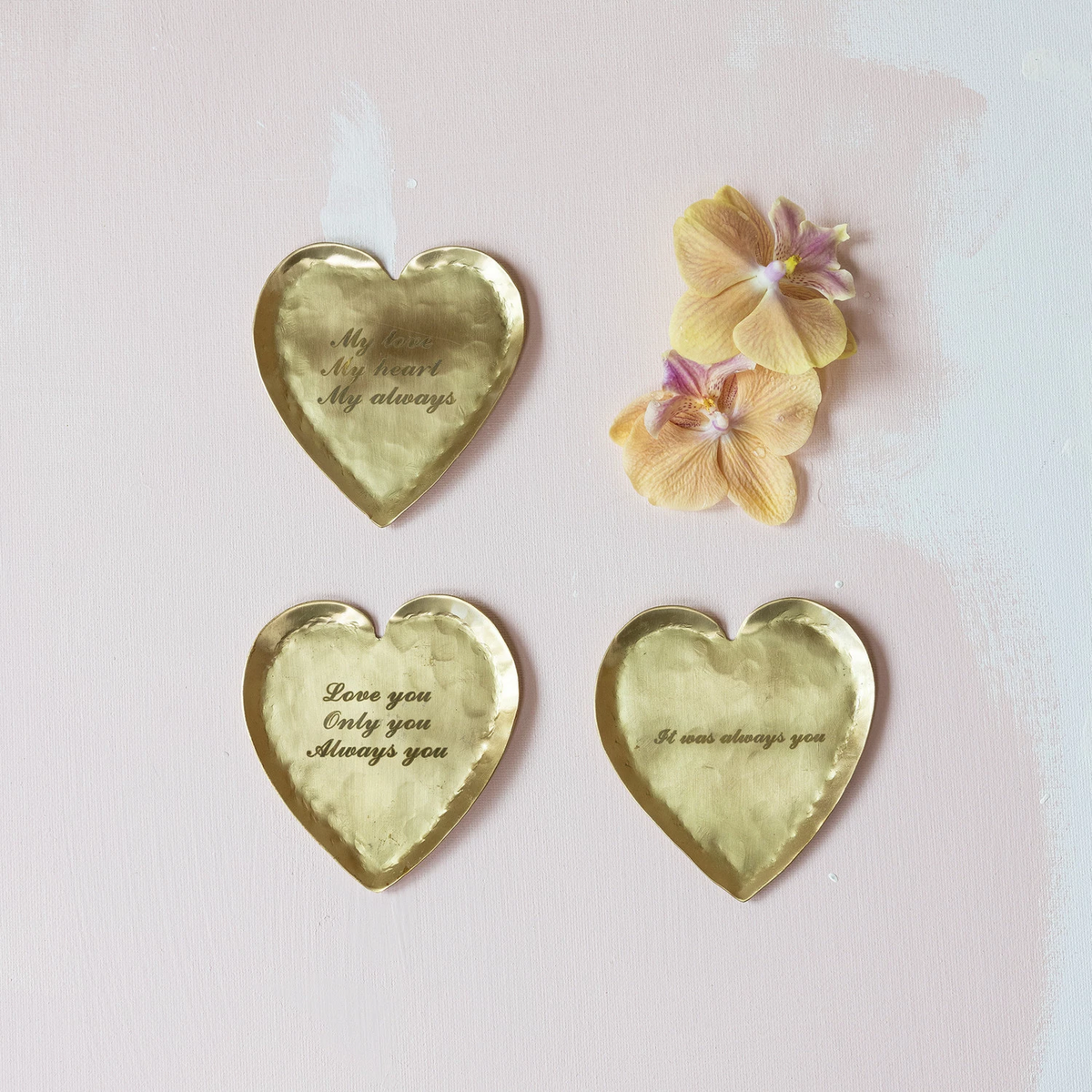 Hammered brass heart-shaped dish with laser-etched saying