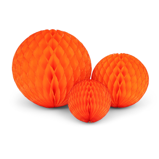 Three bright honeycomb paper balls arranged in a trio.