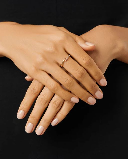Oren Claw Ring in gold with cubic zirconia stones set on a brass base.