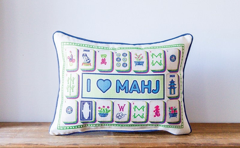 Rectangular white pillow with 'I ❤️ MAHJ' text and colorful mahjong tile illustrations.