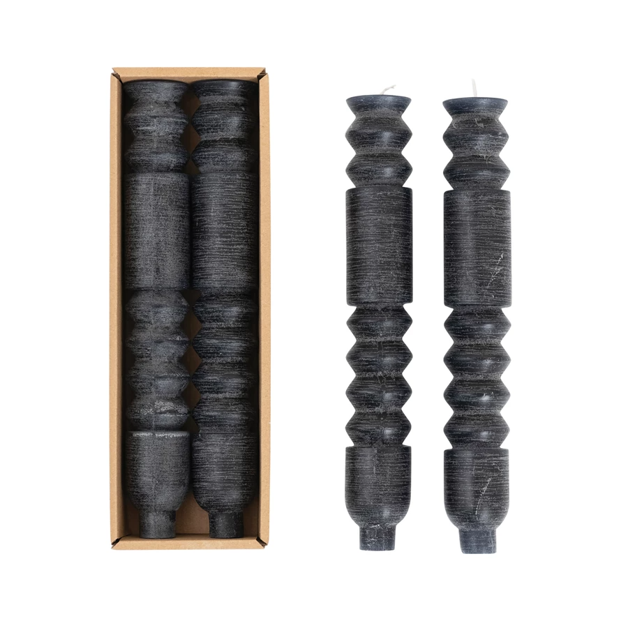 Black unscented totem taper candle with a tall cylindrical shape