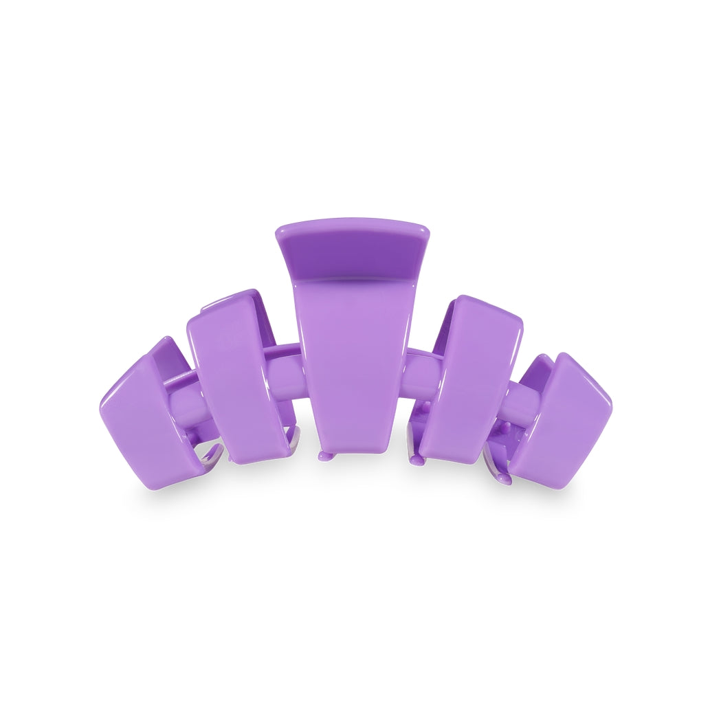 Medium purple classic hair claw clip with a curved, five-prong design on a white background.