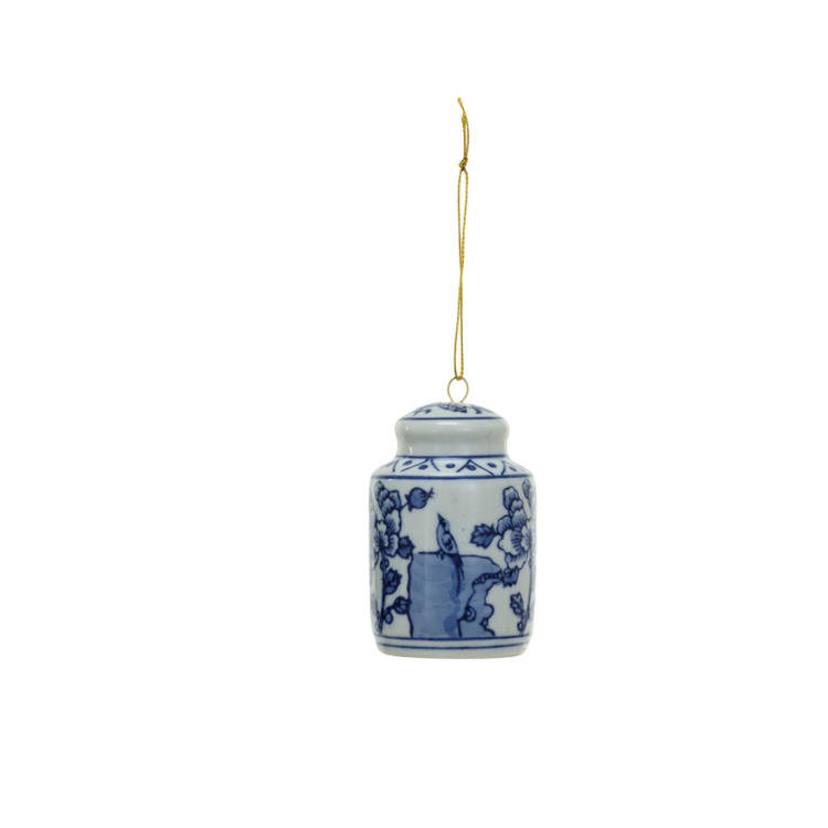 Blue and white stoneware ginger jar ornament with bird and floral design on a gold hanging string.