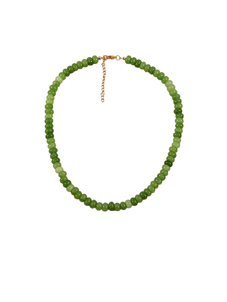 Glass beaded necklace with glossy green beads and a gold-toned lobster clasp and extender chain.