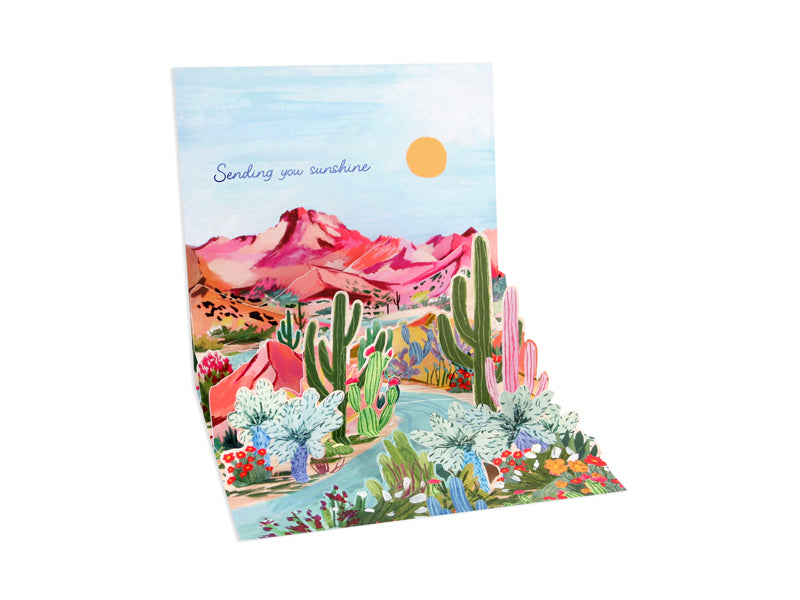 Desert Colors card with periwinkle foil finish inside reading Sending you sunshine in a white envelope.