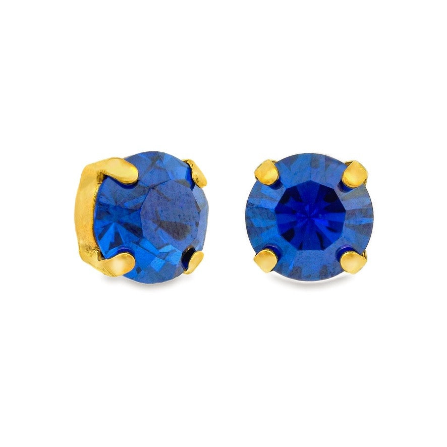 Antique gold plated brass stud earrings featuring large clear crystals in a bohemian style.