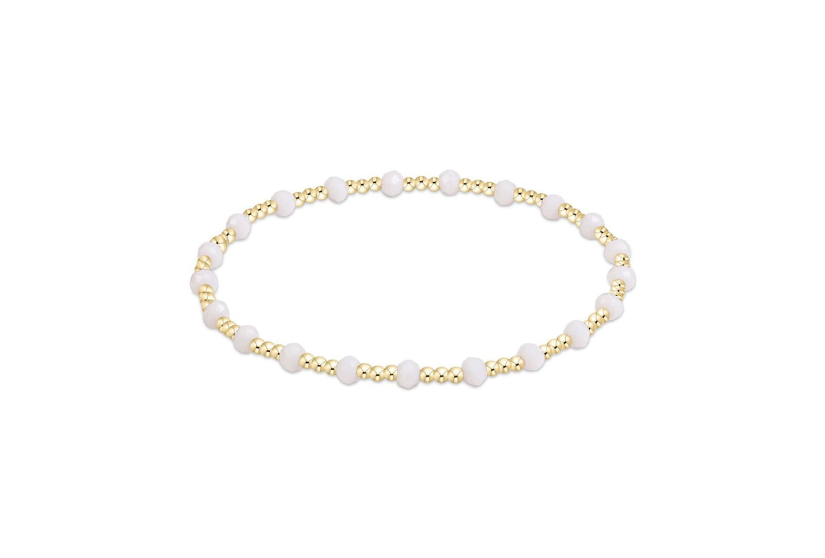 Gameday Flirty Sincerity Bracelet with alternating gold beads and faceted pale pink stones.