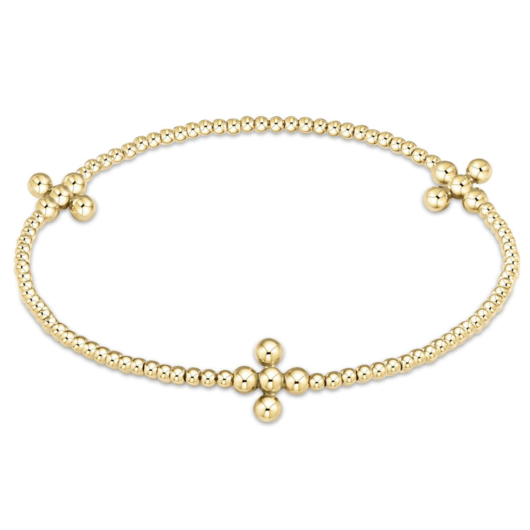 Gold-filled 2.5mm beaded bracelet with three signature cross patterns on a stretch elastic band.