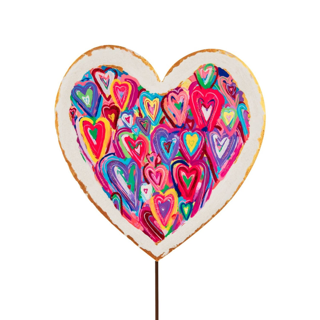 Heart-shaped stake with a messy heart pattern in red on white background