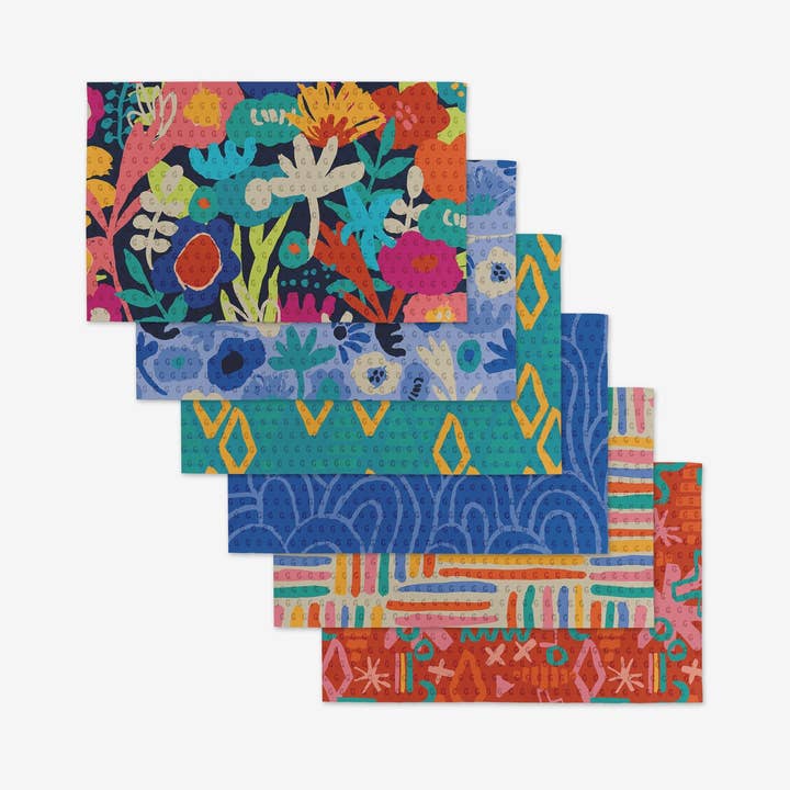 Set of reusable kitchen cloths made from post-consumer recycled materials in a neutral tone.