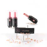 Lip Laster lipstick extractor tool with sliding knob mechanism in black finish.