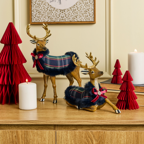 Timeless Tartan Standing Deer figurine with a plaid coat and red bow on a wooden surface.