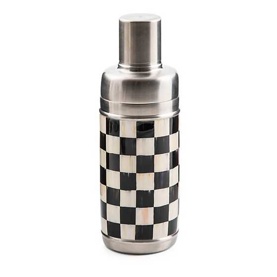 Stainless steel cocktail shaker featuring a black and white checkered enamel pattern on the body.