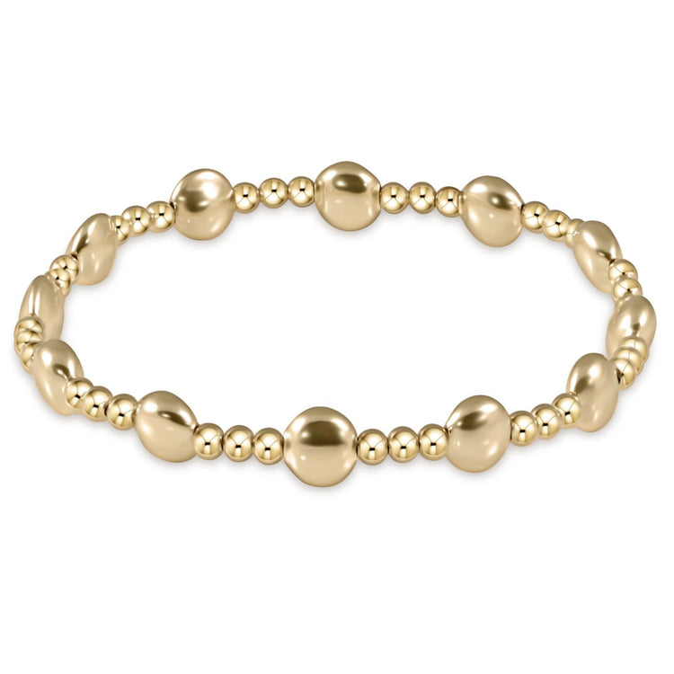 Gold-filled bracelet with 6mm honesty gold beads in a sincerity pattern on elastic cord