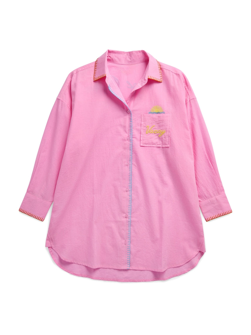 Oversized button-down cover-up shirt in light beige cotton with embroidered 'Vacay' pocket detail and 'Out of Office' back text.