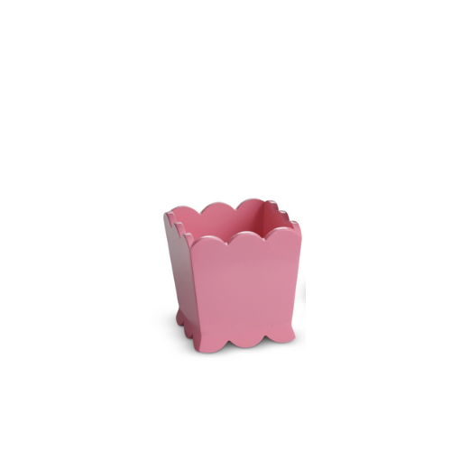 Pink scalloped square planter with a decorative wavy rim and base.
