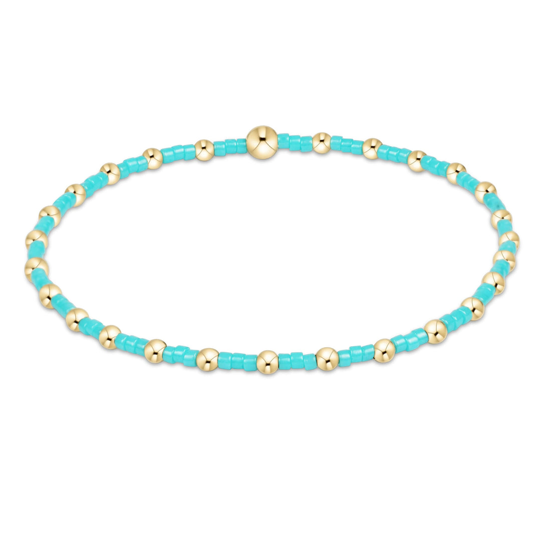 Hope Sincerity bracelet featuring a gold-filled seed bead charm on stretch elastic cord.