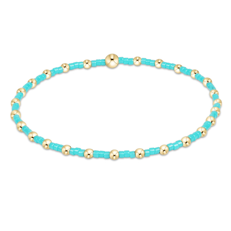 Hope Sincerity bracelet featuring a gold-filled seed bead charm on stretch elastic cord.
