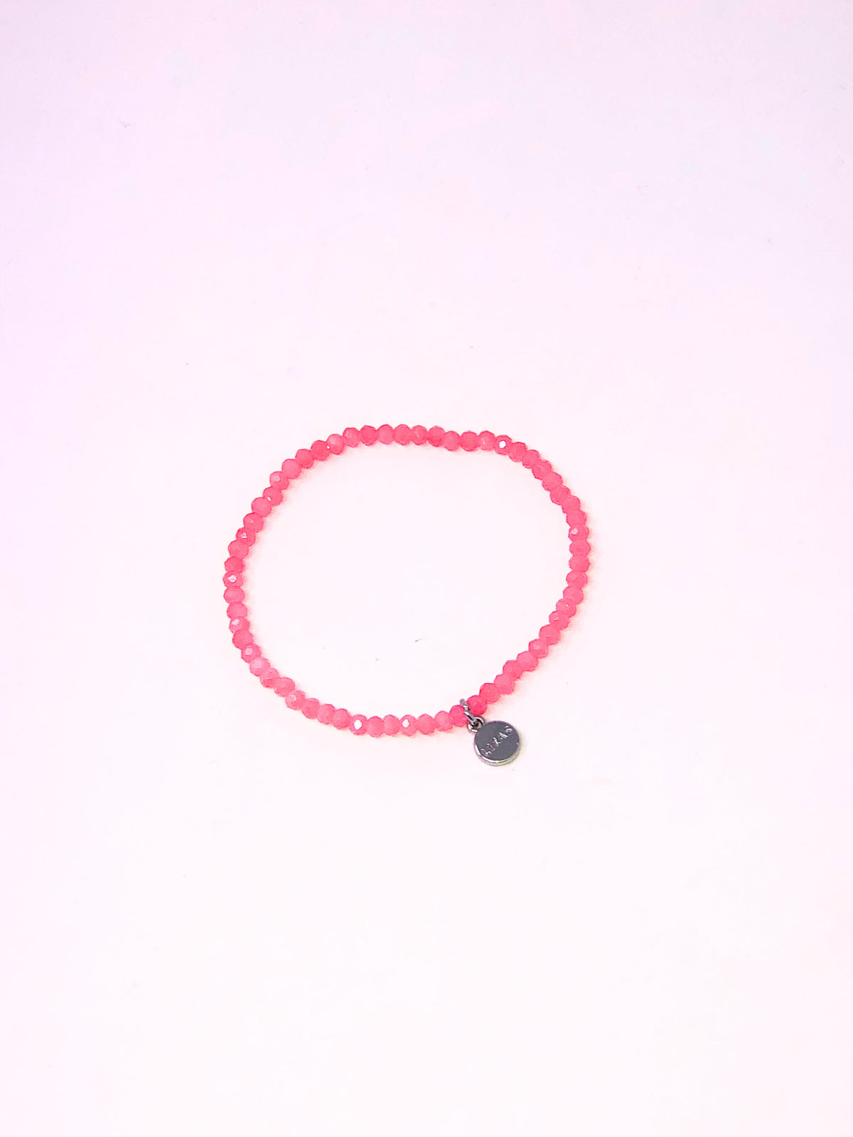 Stretchy bracelet with faceted glass beads in mixed colors on a white background.