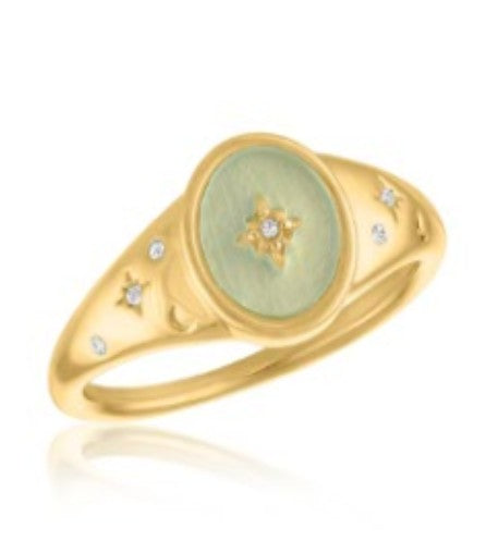 Gold signet ring with a light green oval face featuring a starburst and small inset crystals.