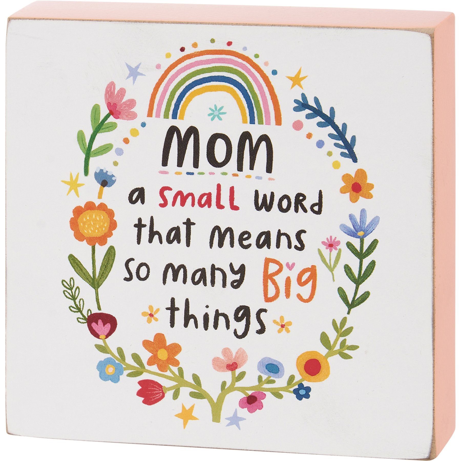 Wood block sign with pink sides displaying the text Mom A Small Word Big Things.