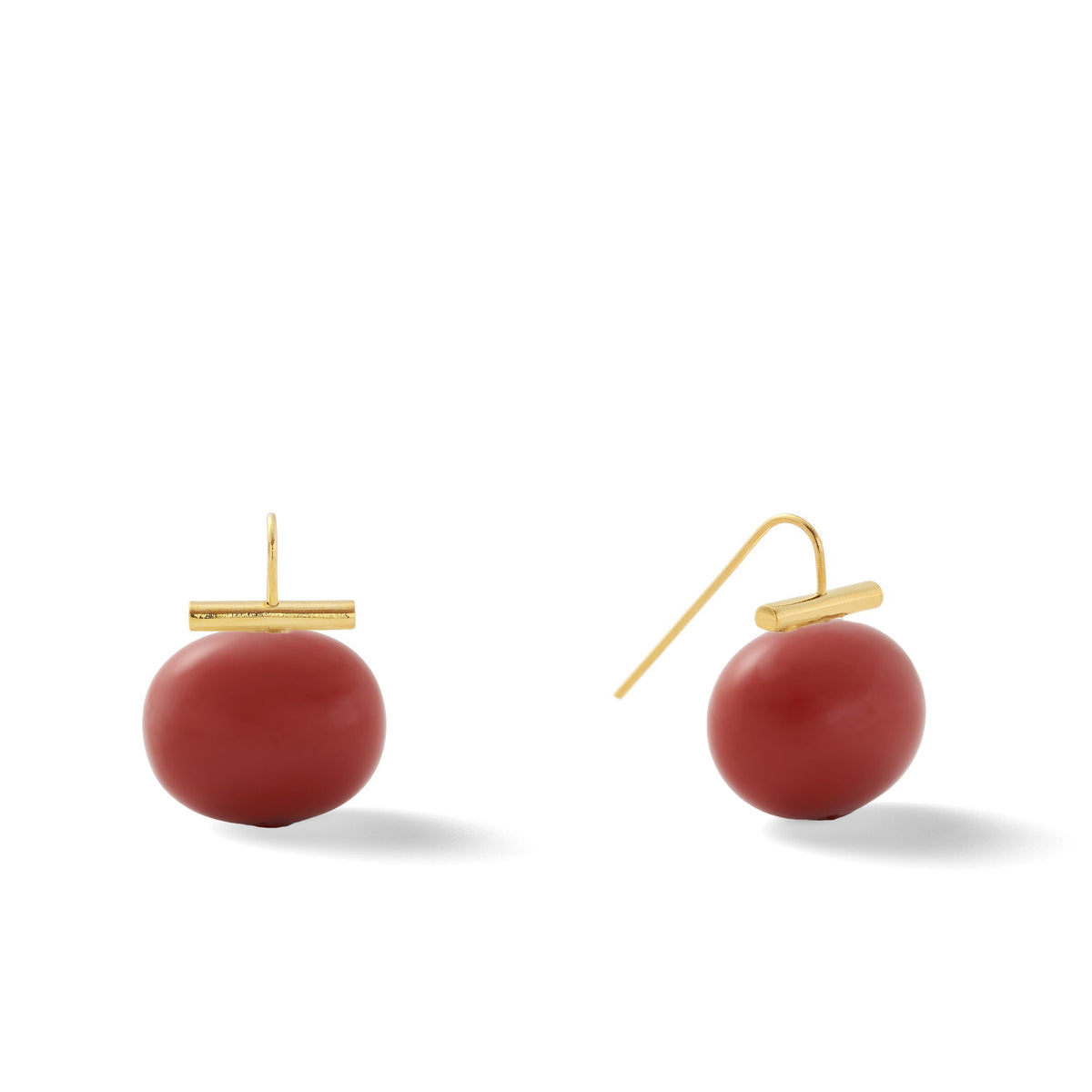 Large red pebble pearl earrings with 14-karat gold-plated ear wires on a white background.