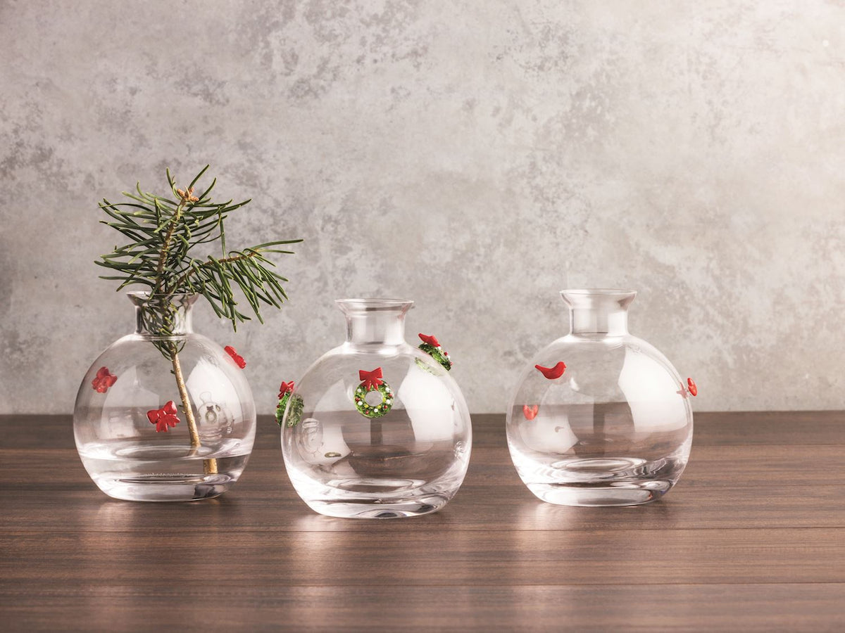 Set of Christmas glass bud vases with a festive icon pattern.