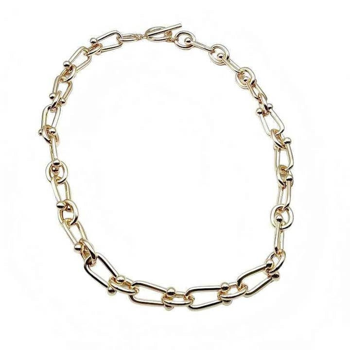 Gold U link chain necklace with a toggle clasp closure on a white background.