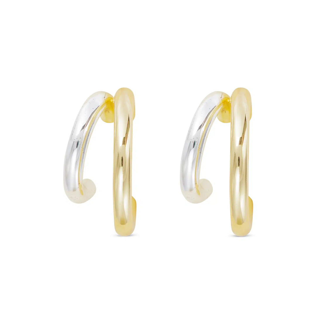 A pair of polished double hoop earrings featuring one gold and one silver hoop on each earring.