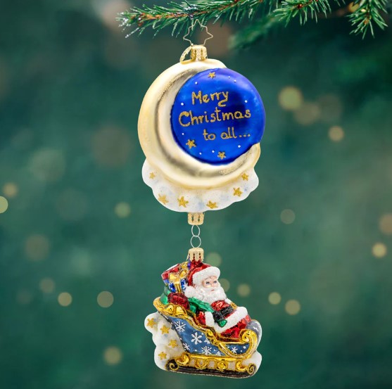 Moonlight Sleigh Ride glass ornament featuring Santa in a sleigh hanging below a crescent moon.