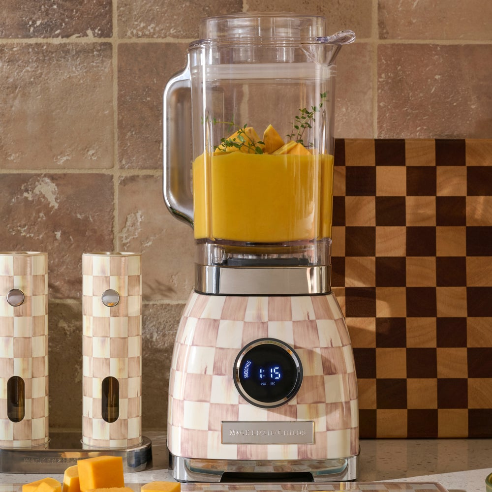 Mocha Check Blender with a patterned base, clear pitcher, and digital display on a kitchen counter.