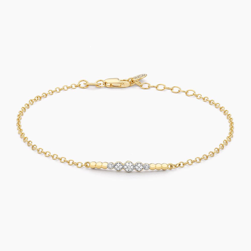 Beaded Connection Chain Bracelet in gold with three diamond-studded circular accents.