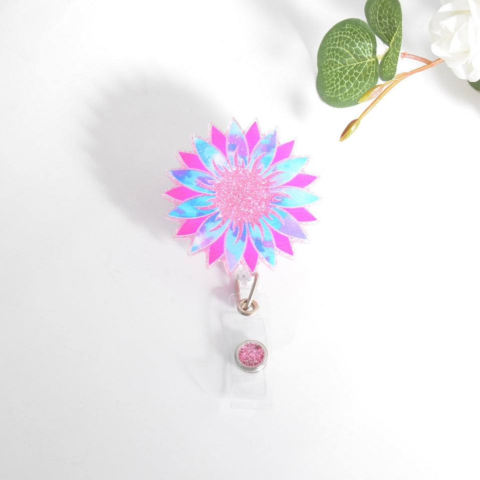 Glitterific badge reel with a glitter resin pin featuring an adorable sparkly silhouette mounted on a black alligator clip.