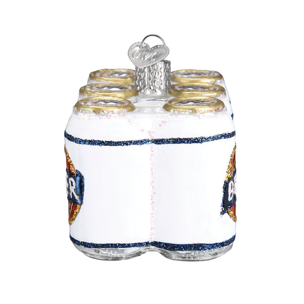 Glass Christmas ornament shaped like a six-pack of white beer cans with glitter accents.