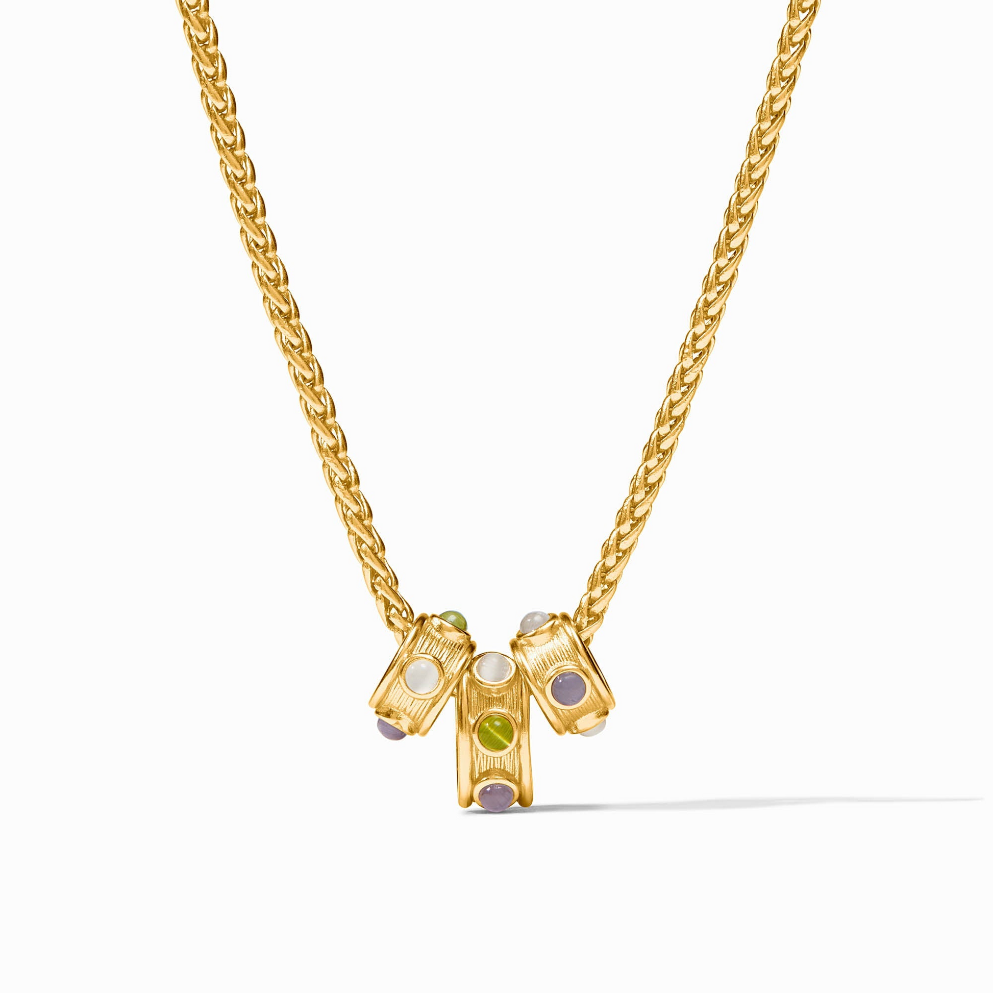 Gold Cobblestone Loop Necklace with three cylindrical charms featuring multicolored gemstones.