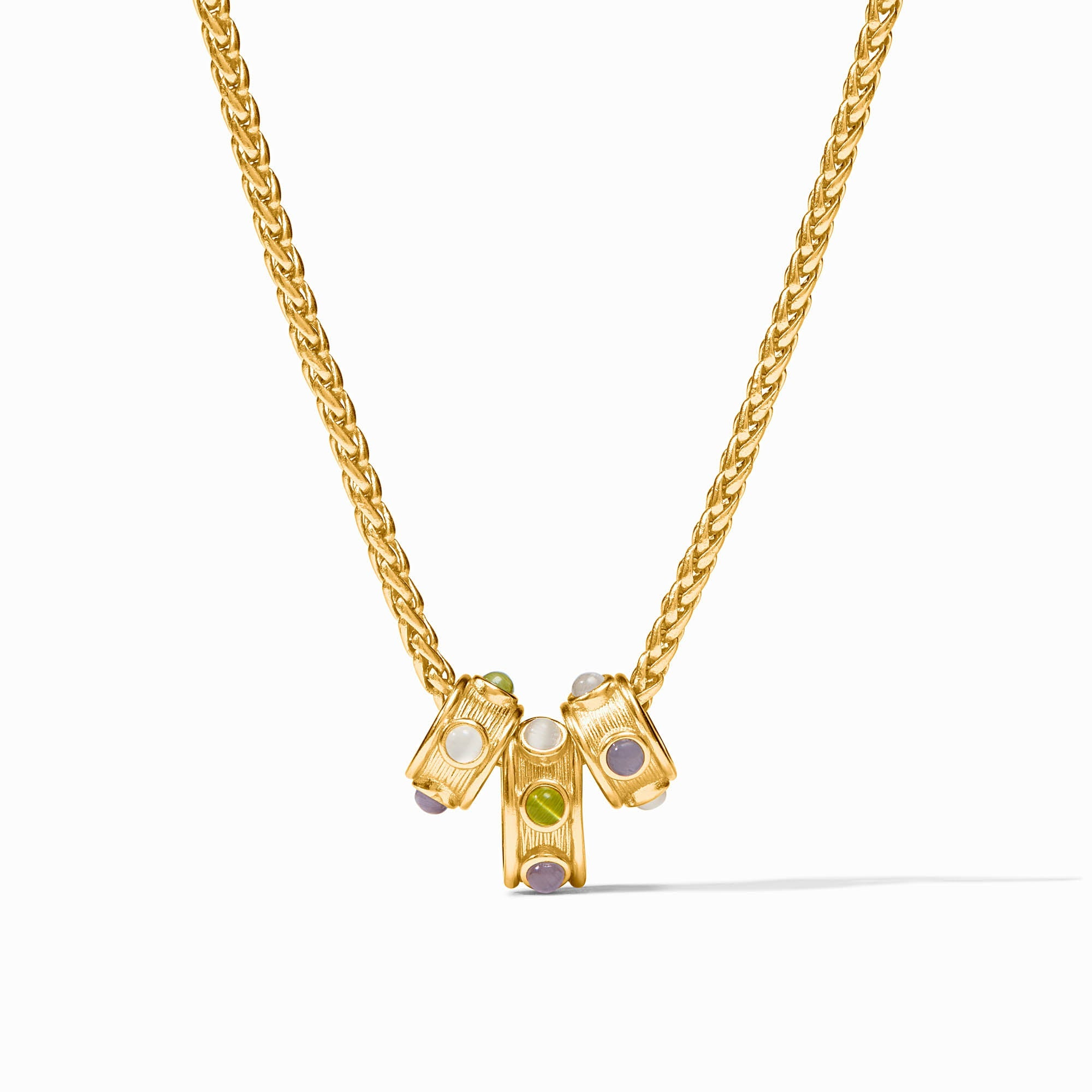 Gold Cobblestone Loop Necklace with three cylindrical charms featuring multicolored gemstones.