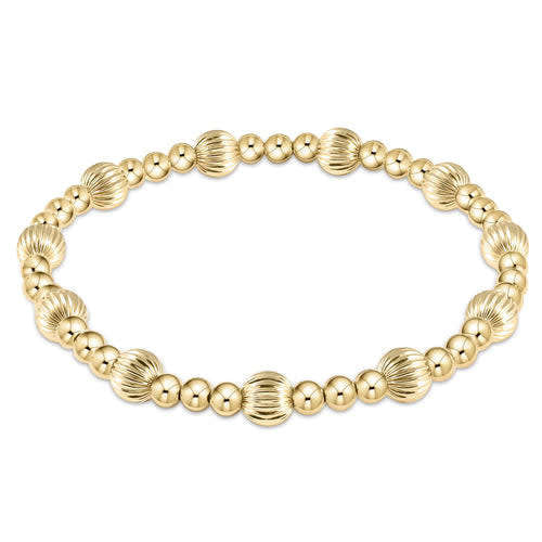 Gold bead bracelet featuring alternating 4mm smooth beads and 6mm textured dignity beads.
