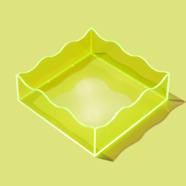 Acrylic wavy square tray with a 6-inch by 6-inch footprint and two-inch height.