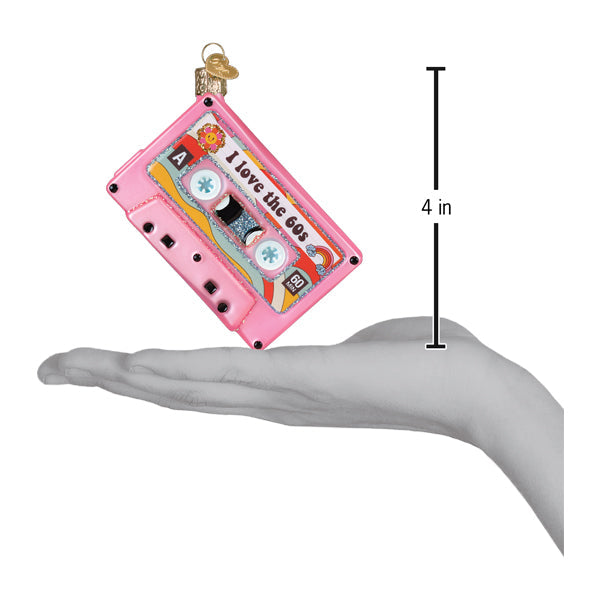 Pink cassette tape ornament with 'I love the 60s' text, shown next to a 4-inch scale.