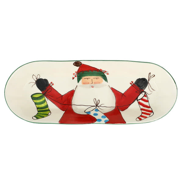 White earthenware Old St. Nick bread server with handpainted red stockings and festive holiday design.