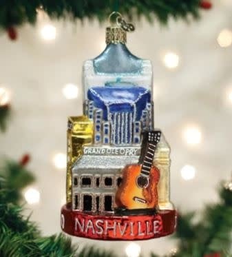 Nashville Ornament: vintage-style glass bauble with Music City skyline silhouette and warm amber glow.
